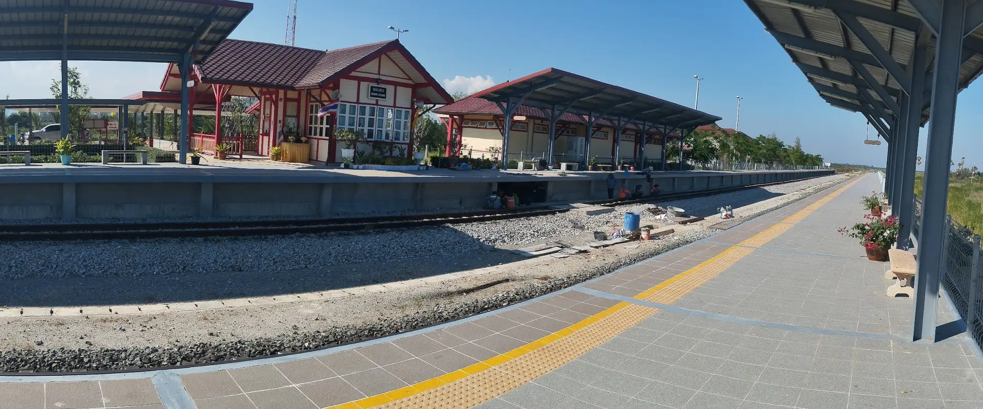 Nong Khang railway station with its named red-and-cream building and platforms in Sila Loi.