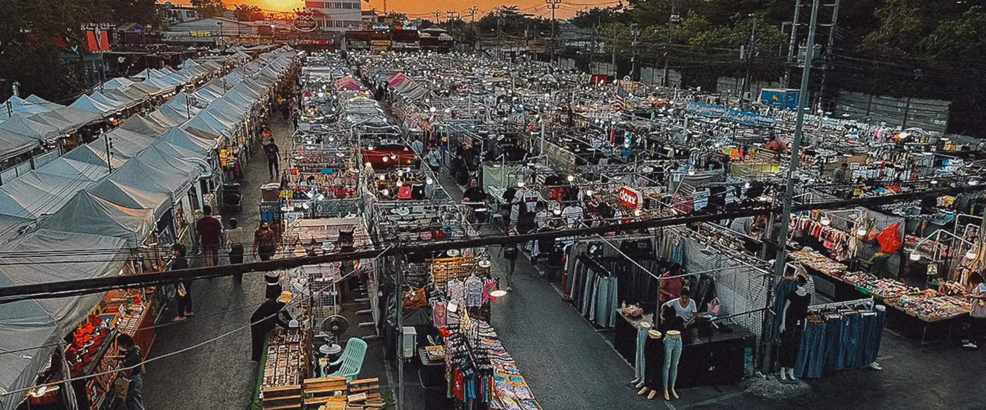 Rows of stalls at sunset in Indy Market Dao Khanong, Bangkok.
