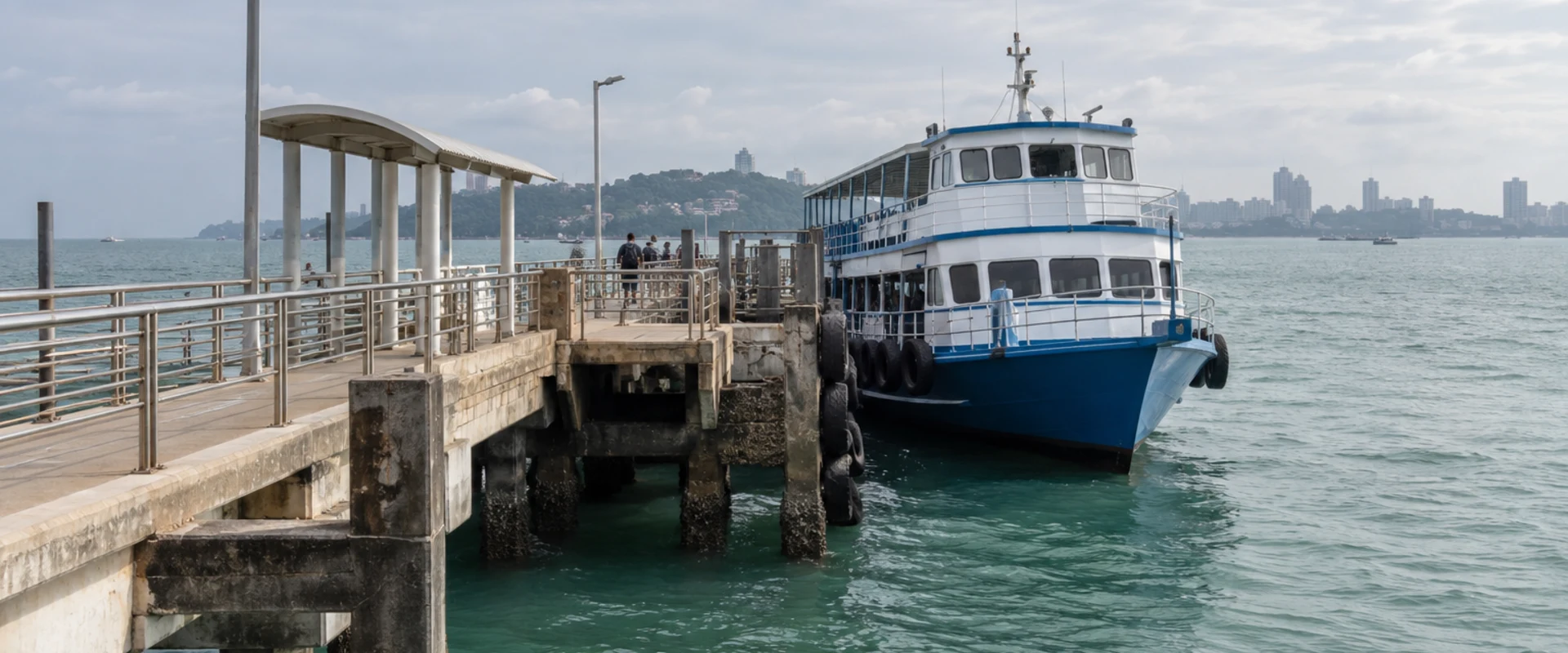 Blue-and-white passenger ferry beside a concrete coastal pier in an AI-generated contextual scene