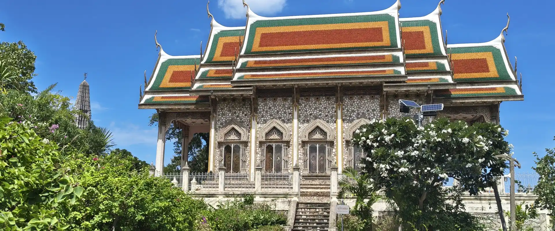 Ornate hall, tiled roof, patterned walls and approach at Wat Khao Krailart, Nong Kae, Hua Hin.