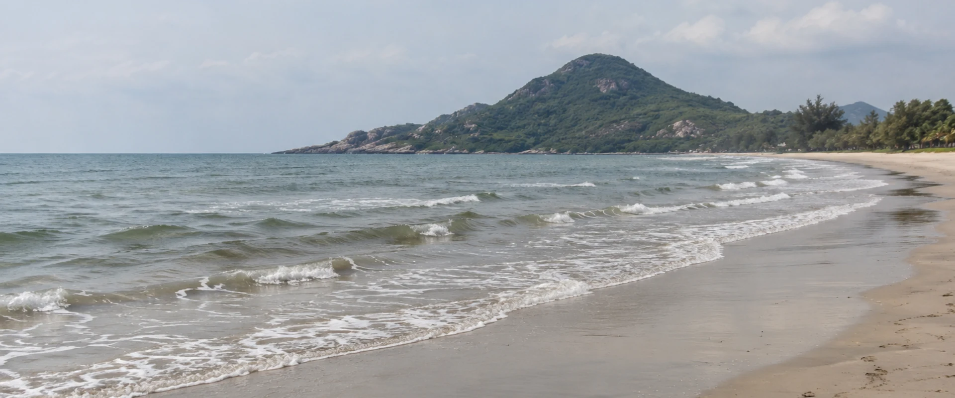 A quiet Gulf of Thailand shoreline with a rocky headland in an AI-generated contextual image
