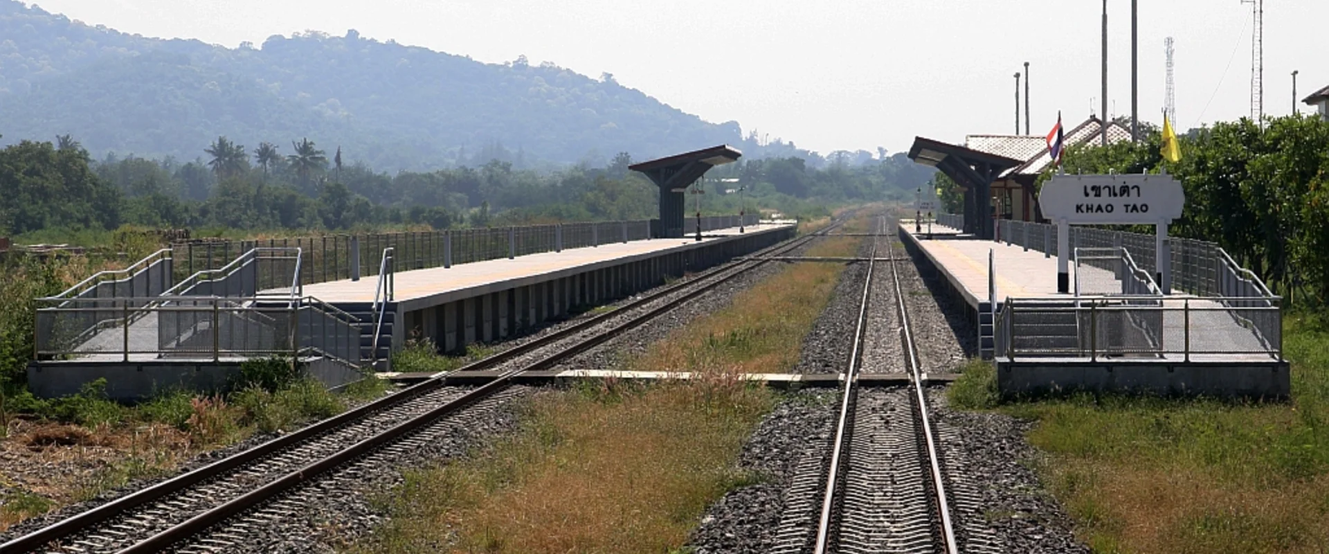 Khao Tao Railway Station new platforms and tracks, with its Thai and English KHAO TAO nameboard.